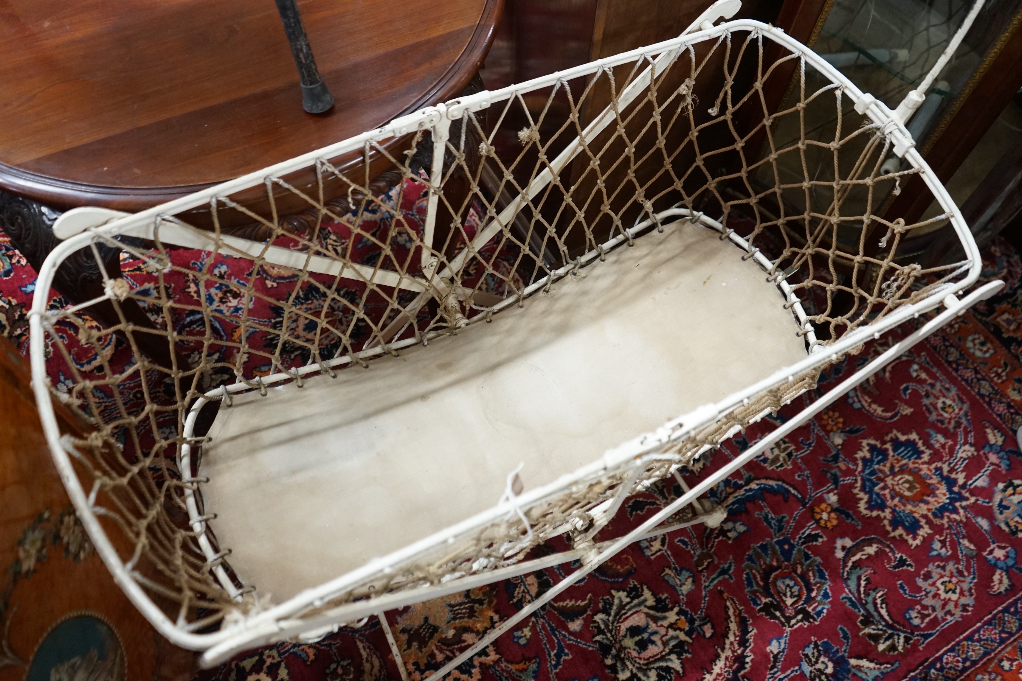 A Victorian metal folding crib, length 90cm, depth 43cm, height 134cm